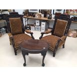 An Edwardian mahogany coffee table on claw and ball feet