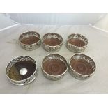 Six silver-plated wine coasters