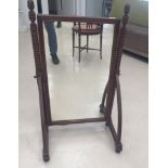 A bobbin-turned Cheval mirror