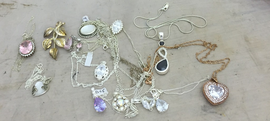 A quantity of semi precious stone set pendants on silver necklaces