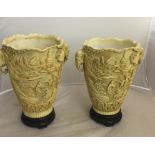 A pair of resin Oriental elephant handled vases