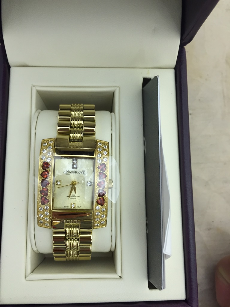 A ladies Ingersoll gem exotic watch set with garnets