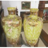 A pair of yellow glass vases
