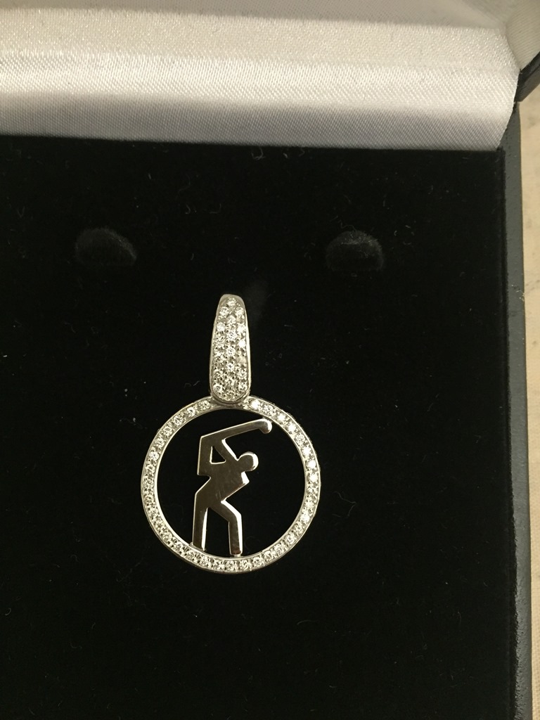 An 18ct diamond set golfing pendant