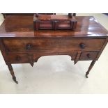 A Georgian mahogany table with drawers