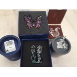 A boxed Swarovski purple butterfly;