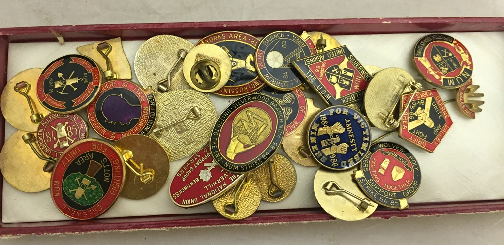 A quantity of miners strike badges