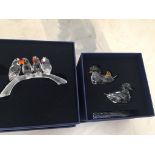 A boxed Swarovski love birds on a branch;