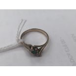 A 9ct emerald and diamond trilogy ring