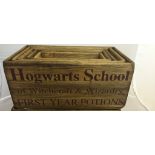 A set of five wooden hogwarts boxes