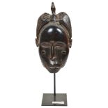 African Tribal Portrait Mask: In the form of a woman with a bird to the top,