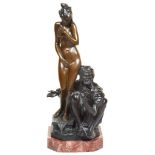 A Bronze Figure of a Seated Man with Standing Nude Lady