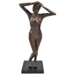 T Shattock (1944-present): A bronzed resin figure, "Standing Lady I",