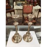 A pair of HM silver candlesticks