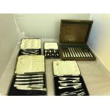 A cased set of six mother-of-pearl and silver fruit knives and forks;