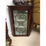 An 18th century mahogany glazed wall cabinet (glass A/F)