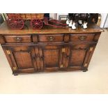 A 20th century oak sideboard by Titchmarsh & Goodwin