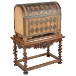 A dome-shaped chest on stand: a brass mounted Victorian dome shaped chest with velvet lined