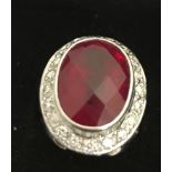 An 18ct ruby and diamond dress ring,