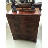 An Edwardian two over three chest of drawers