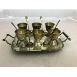 A silver egg cruet fitted with six silver egg cups and six spoons,