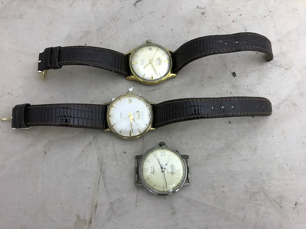 Three vintage Avia day date automatic wristwatches