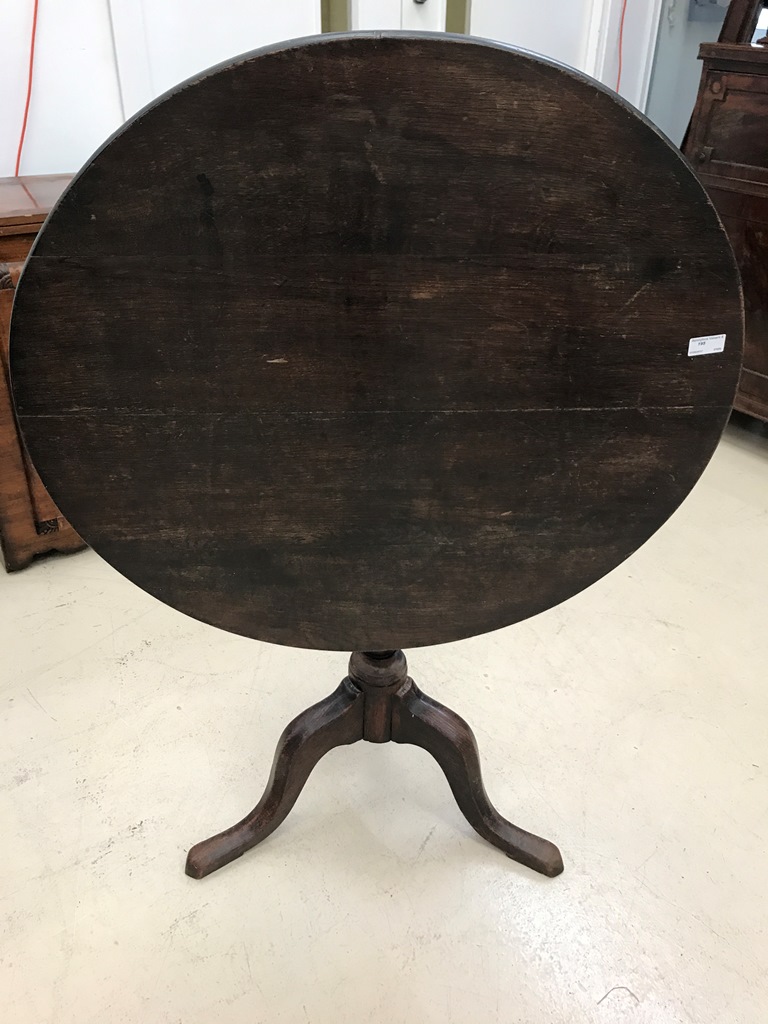 A 19th century oak tilt-top table