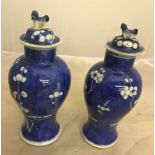 A pair of prunus pattern lidded vases