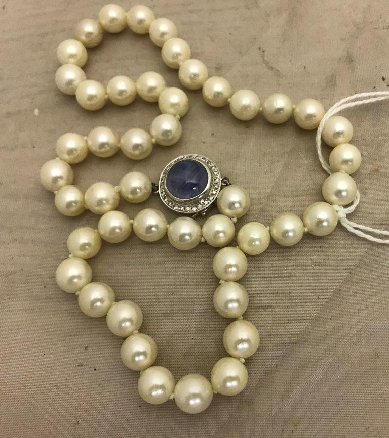 A 14k sapphire and diamond clasped pearl necklace