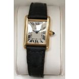 A boxed and cased Cartier 18k Tank ladies watch on leather strap with Cartier 18k buckle: all