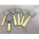 Six bone-handled magnifying glasses