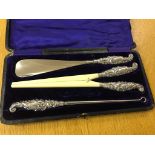 A cased hallmarked silver ladies dressing set