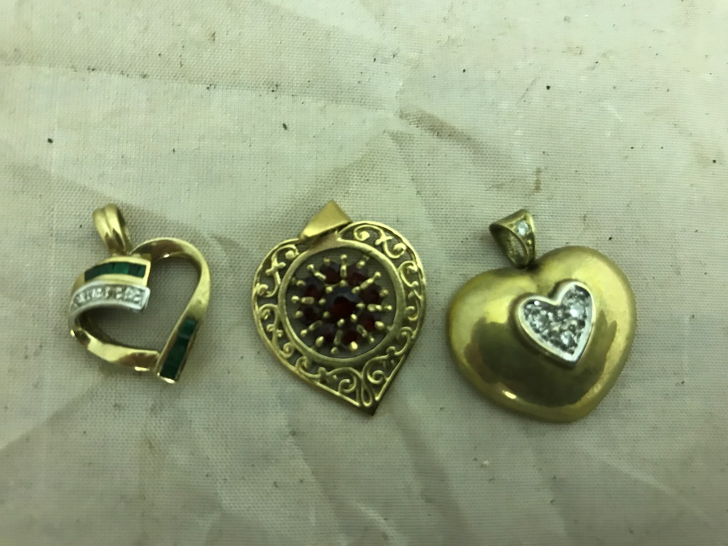 Three gold heart pendants, diamond, emerald,