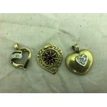 Three gold heart pendants, diamond, emerald,