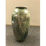 A Ruskin tea dust green lustred glazed vase (hairline crack)