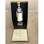 A boxed Royal Worcester figure of the British Red Cross Society VAD member from the Nursing Sisters