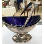 A HM silver sugar basket with blue glass liner