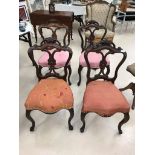 A set of four Victorian mahogany dining chairs