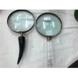 Two large magnifying glasses