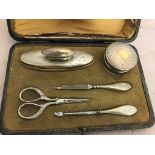 A cased silver manicure set