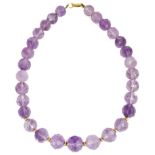 An 18ct gold clasped graduated faceted amethyst bead necklace