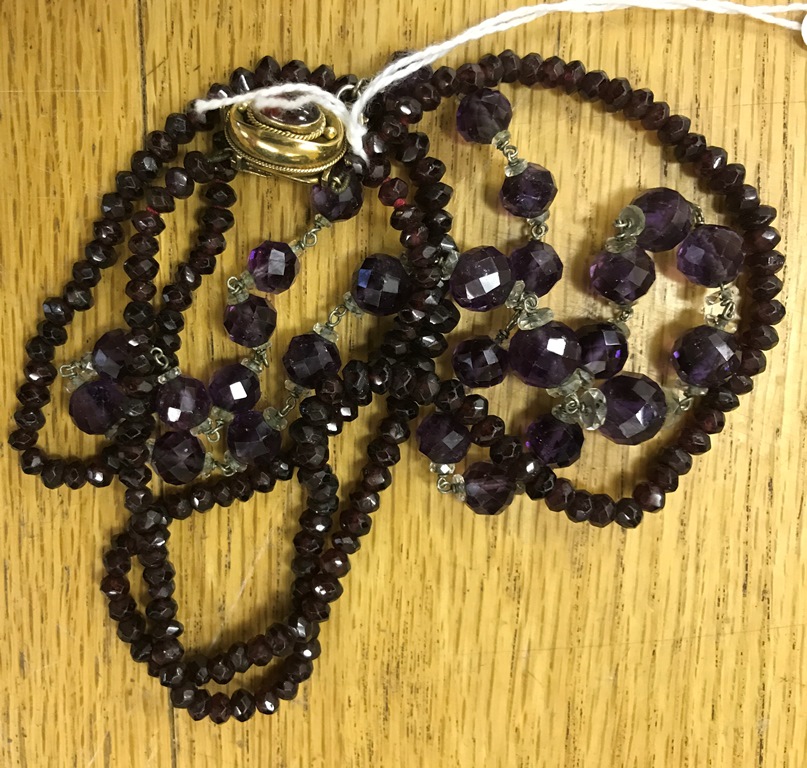 A garnet dress necklace;