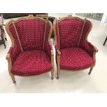 A pair of French walnut fauteuilles