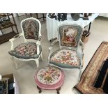 Two decorative open arm chairs with needlework upholstery: one of flowers,