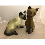 Two ceramic models of cats