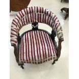 An Edwardian mahogany-framed tub chair