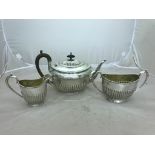 A hallmarked silver tea pot by Mappin & Webb;