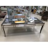 A large mirrored dining table
