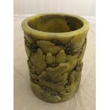 Carved Jade brush pot with carved people walking by a mountain, 10 cm x 8 cm.