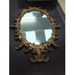 An ornate gilded mirror in the 19th century style